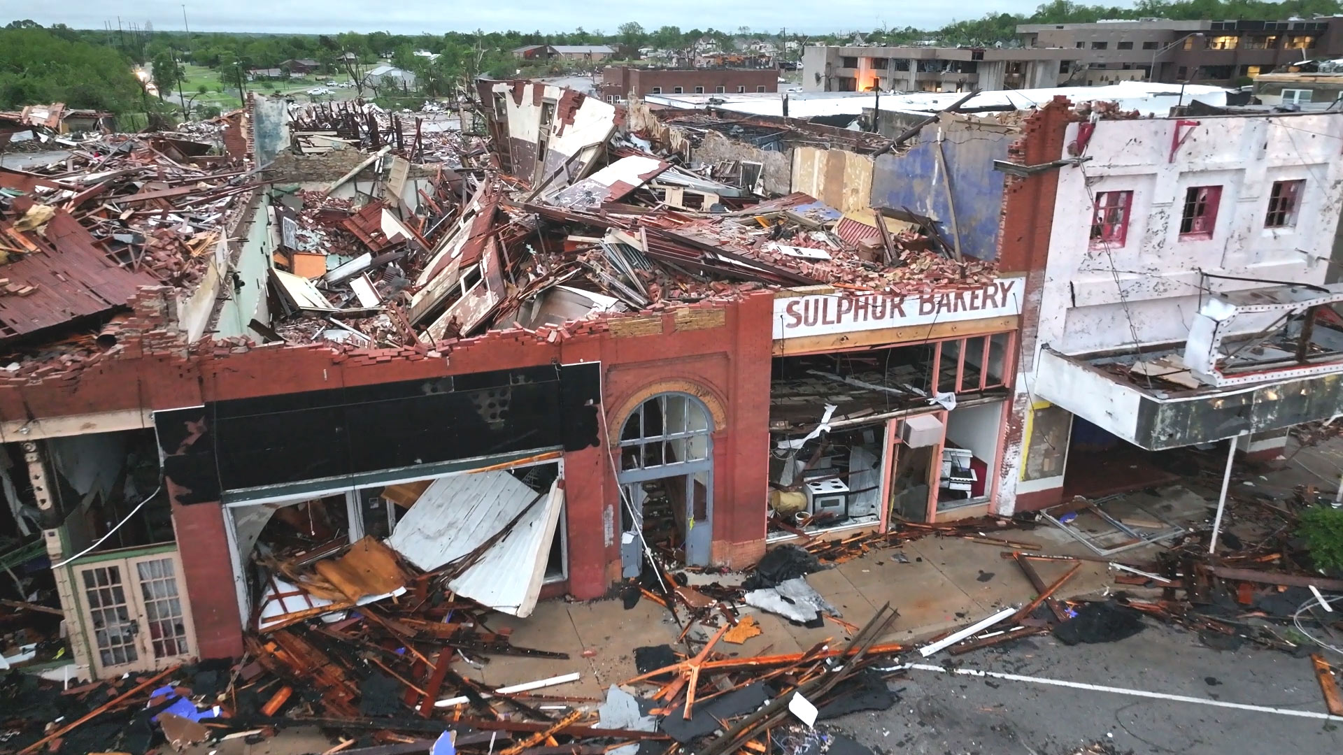 Complete destruction of commercial buildings in downtown Sulphur, Oklahoma, including a bakery.