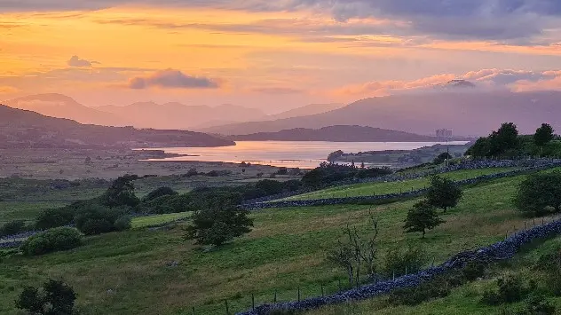 Sunset over Welsh lake.