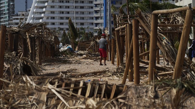 Destroyed huts on beach after hurricane