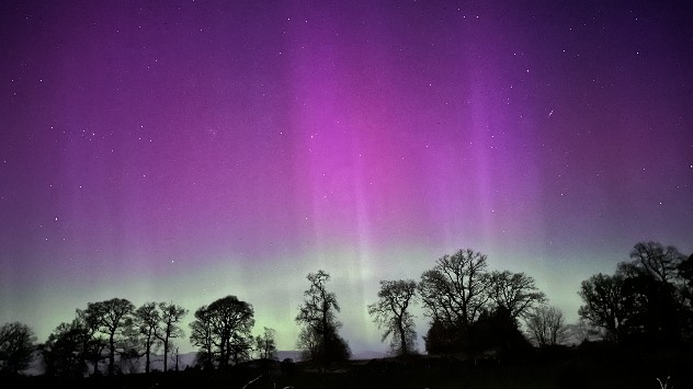 Picture of the Northern Lights, also known as the aurora borealis, shining over Scotland in April 2024.