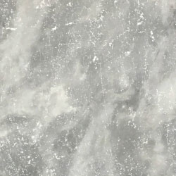 A close up of a gray granite counter top