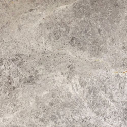 A close up of a gray granite counter top