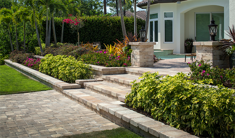 A large swimming pool is surrounded by a wooden deck