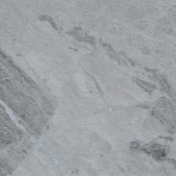 A close up of a gray granite counter top