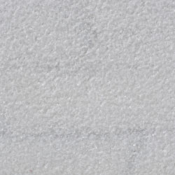 A close up of a gray granite counter top