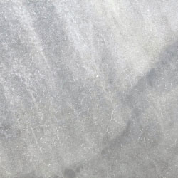 A close up of a gray granite counter top