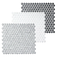 A set of three tiles with circles on them on a white background.