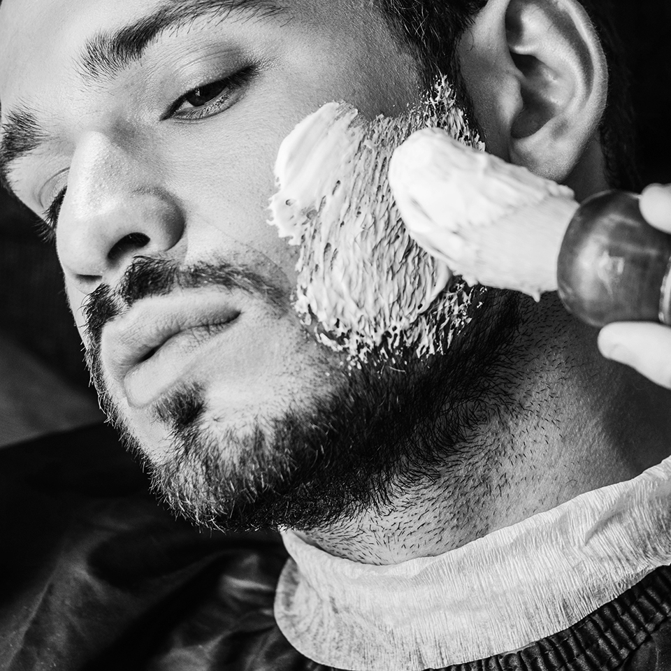 Man putting shave cream on face