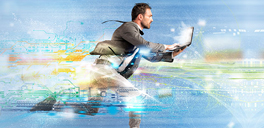man running with a laptop