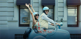 couple riding a double seater vehicle