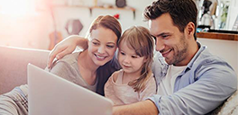 family at home on computer