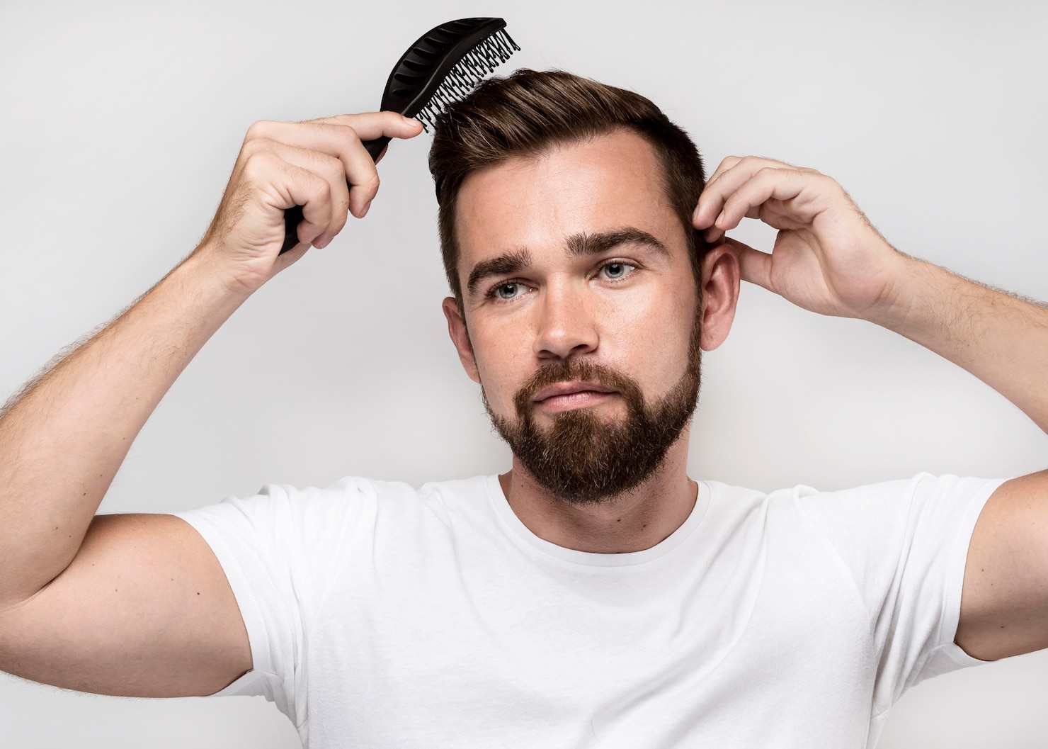 front-view-man-brushing-his-hair 23-2148696630