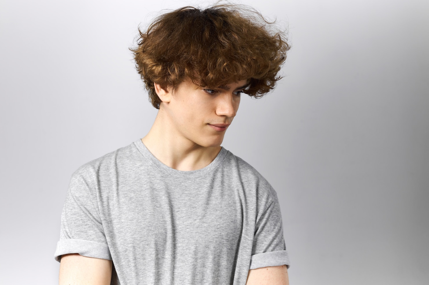 human-emotions-feelings-reaction-studio-shot-attractive-curly-haired-young-man-casual-wear-posing-against-gray-background-looking-down-having-pensive-thoughtful-facial-expression 343059-2468