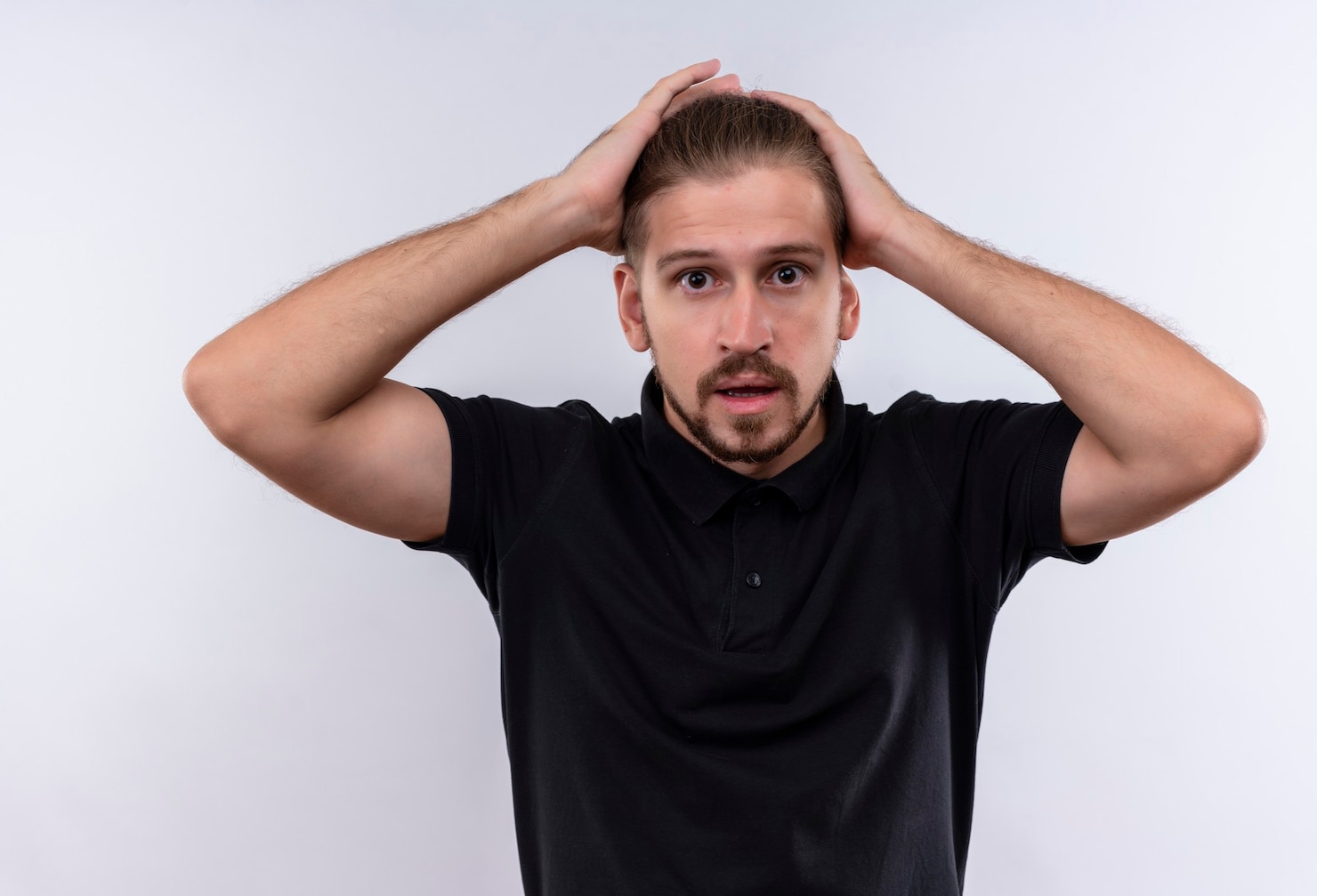 young-handsome-man-black-polo-shirt-looking-confused-worried-touching-his-head-with-hands-standing-white-background 141793-21154