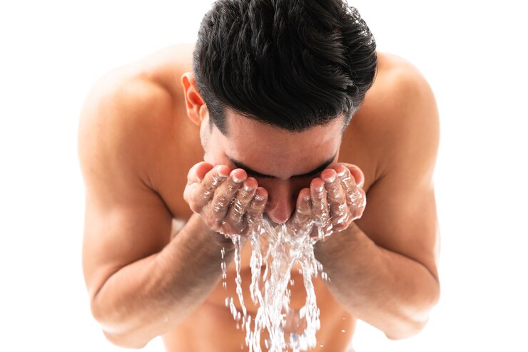 closeup-young-man-splashing-some-water-his-face 662251-2858