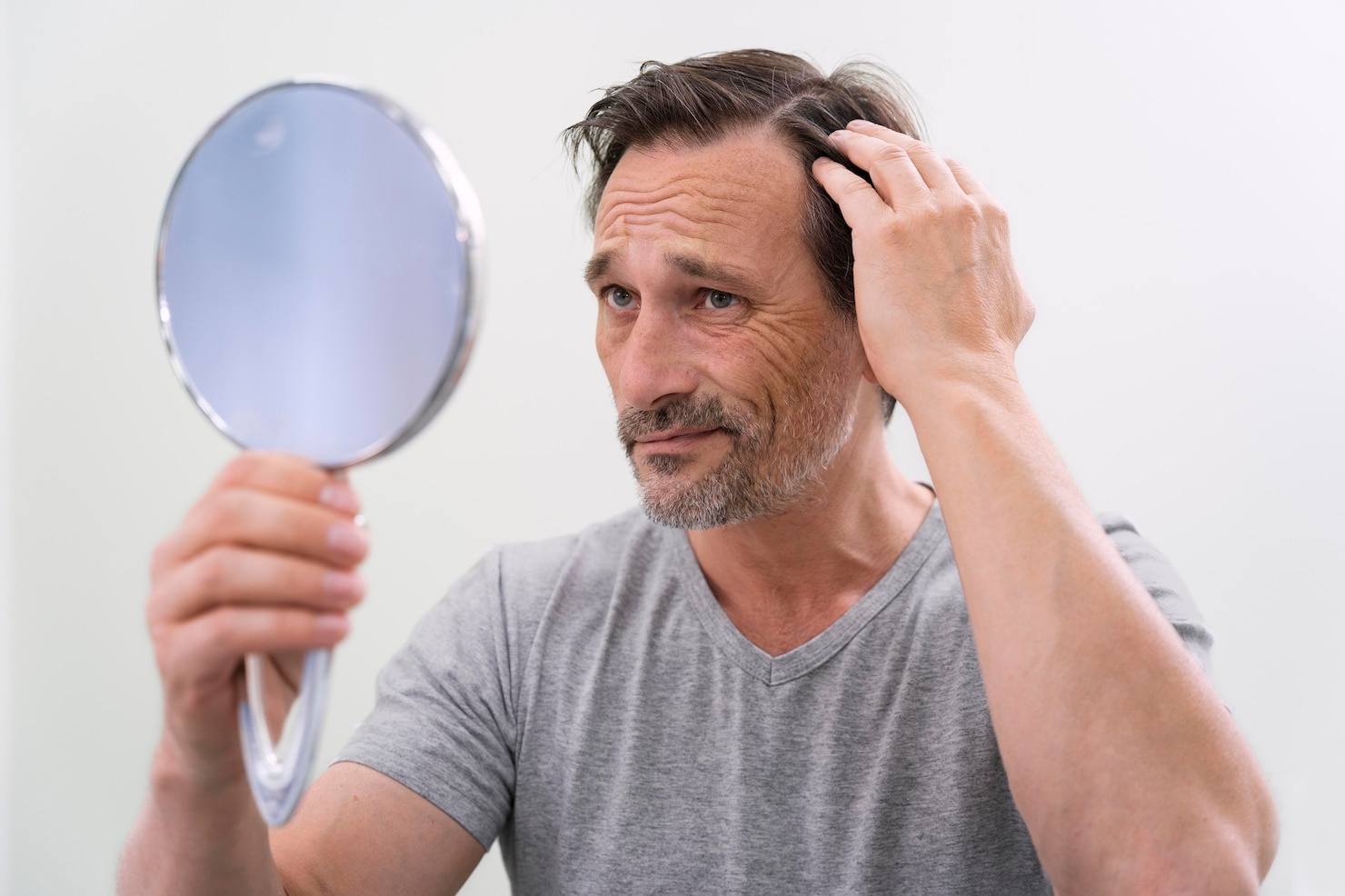 man-getting-hair-loss-treatment 23-2149152763