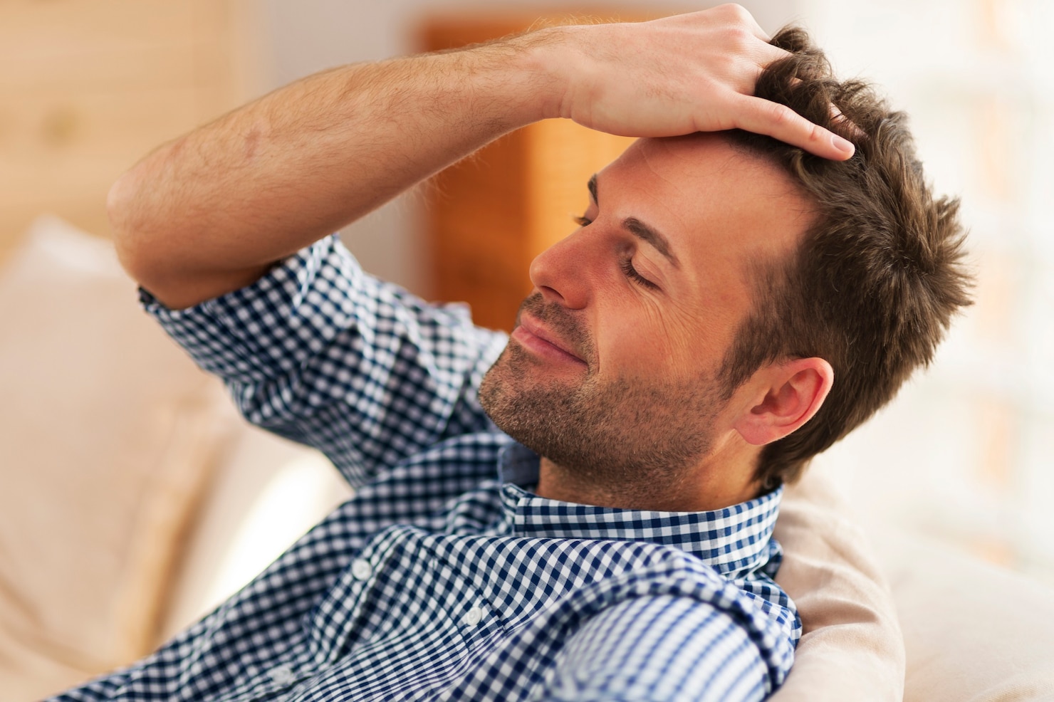 smiling-man-with-hand-hair 329181-639