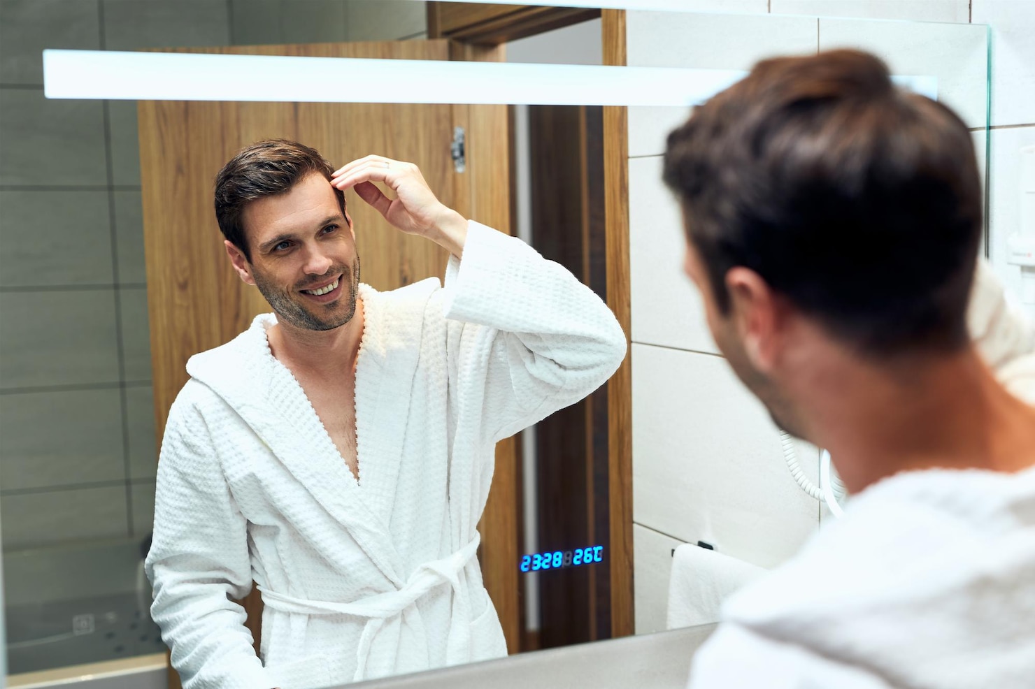 reflection-mirror-happy-man-bathrobe-adjusting-his-hairstyle 637285-7680