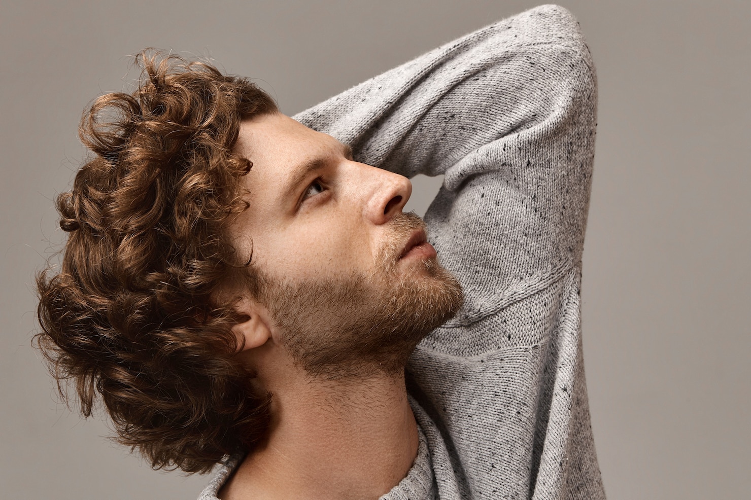 style-fashion-masculinity-mena-s-wear-concept-portrait-stylish-unshaven-man-with-beautiful-profile-touching-his-curly-hair-looking-up-with-thoughtful-facial-expression-wearing-gray-jumper 343059-2576