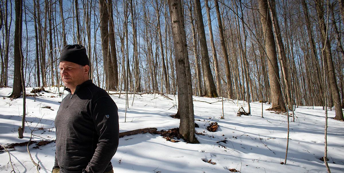 Jarrod Hatfield, an REI Co-op Member, walks his family’s forest in Wyoming County, West Virginia, in late March 2022. Photo by William Wolfe, courtesy of REI.