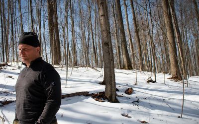Jarrod Hatfield walks his family’s forest in Wyoming County, West Virginia, in late March 2022. Photo by William Wolfe, courtesy of REI.

