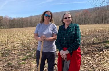 Sarah Hall, National Director of Forestry for the Family Forest Carbon Program, and landowner Louise Hartman, who enrolled her Northumberland County forest in the program in the fall of 2020. Credit: Kara Holsopple / The Allegheny Front.