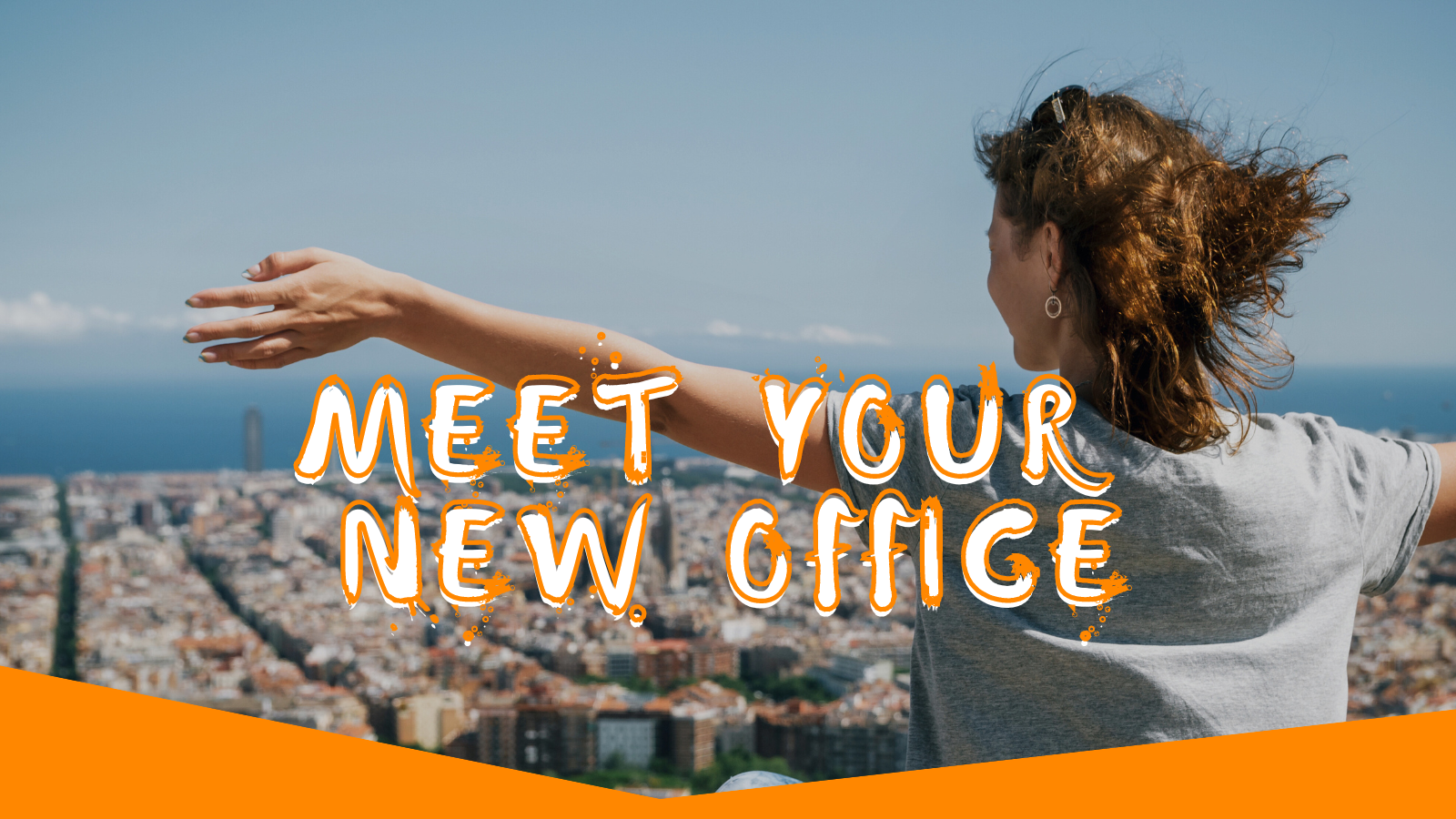 A joyous woman looks over Barcelona, overlaid by the words "Meet your new office"