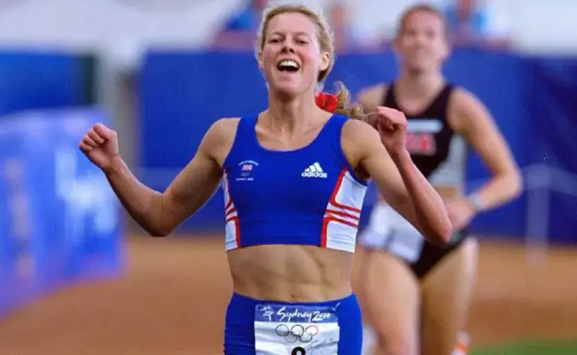 Steph Cook running while wearing a blue Team GB outfit.