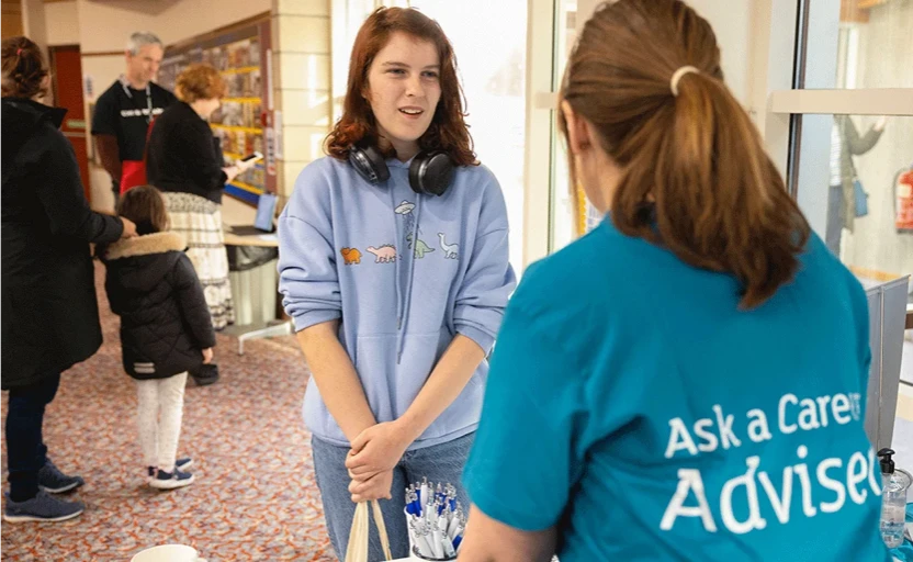 a girl speaking to a careers adviser 