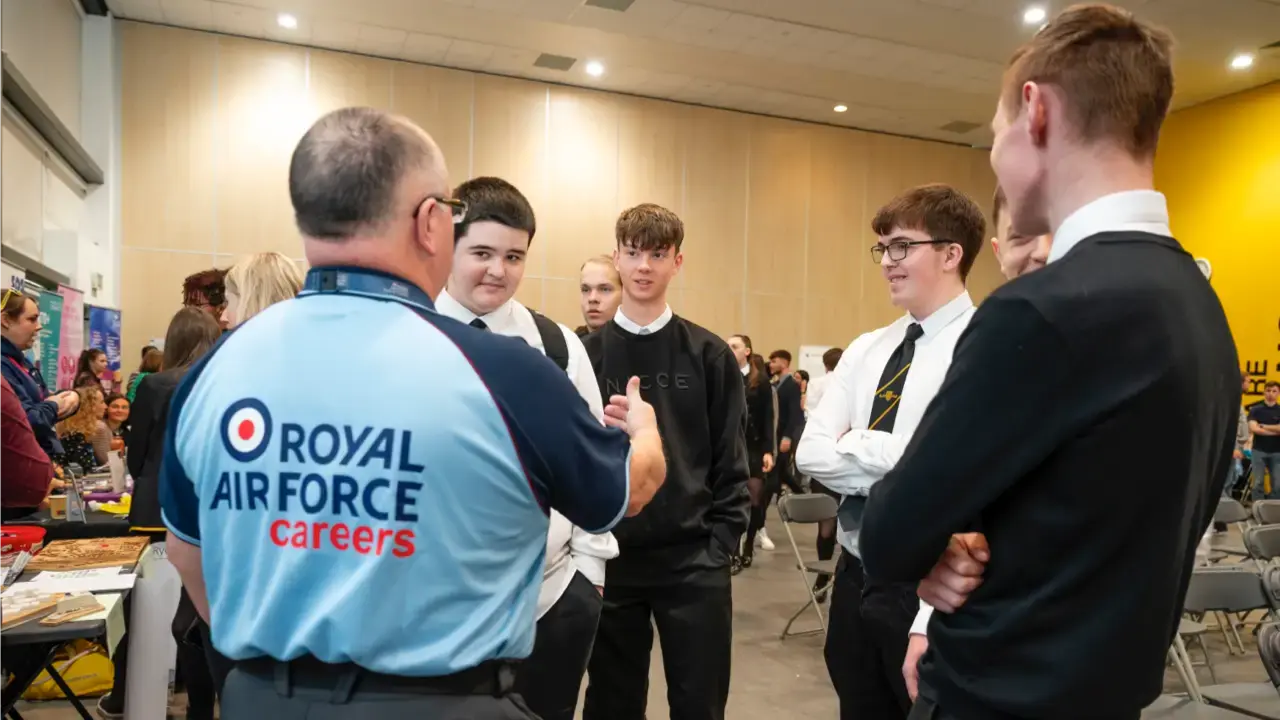 An RAF careers employer chatting to a group of school pupils