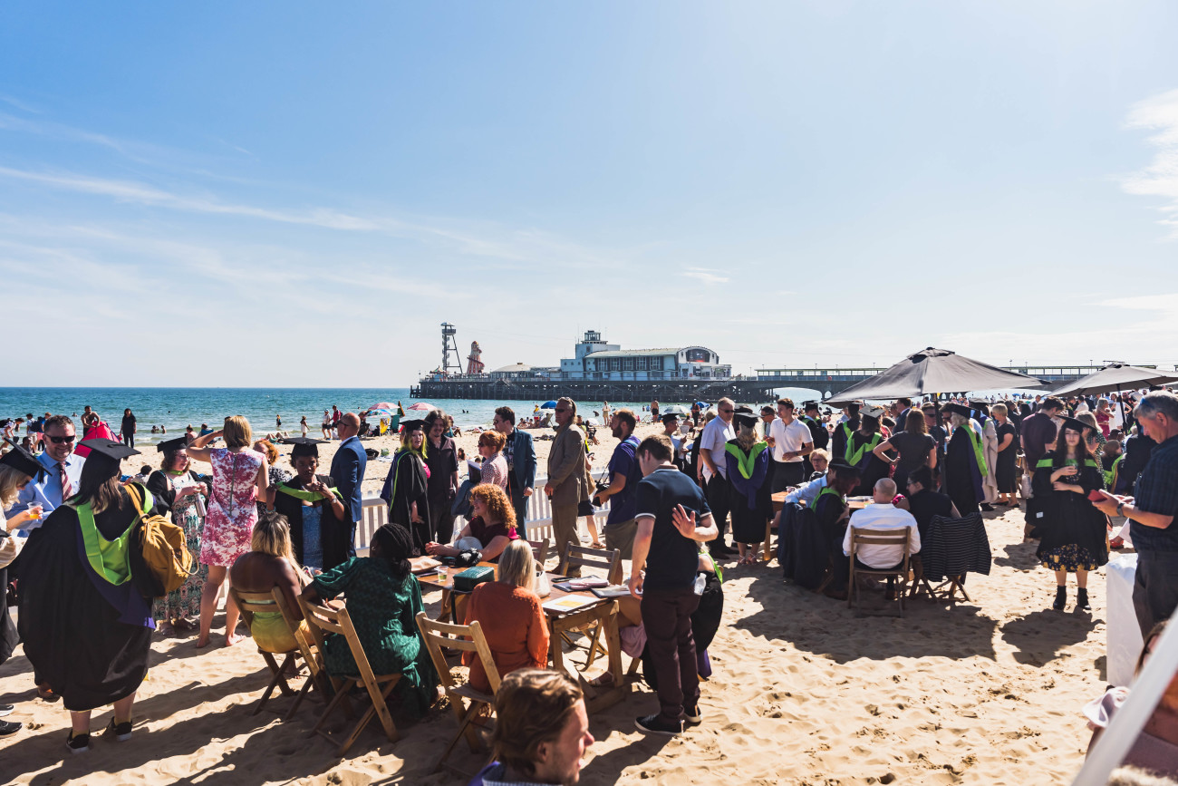 Graduates celebrate on Bournemouth Beach