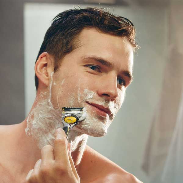 Man shaving beard