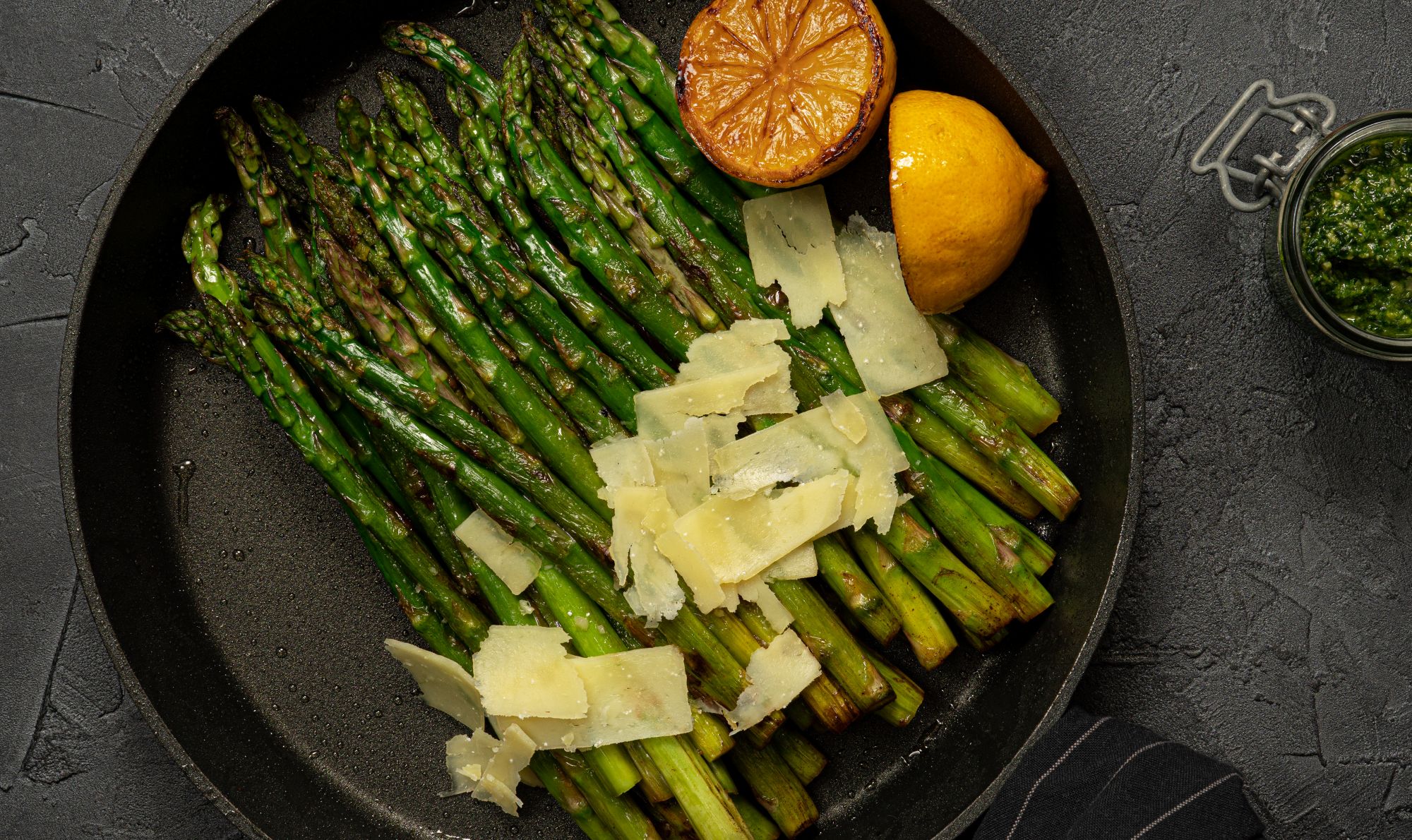 Pan-fried green asparagus with Parmesan shavings