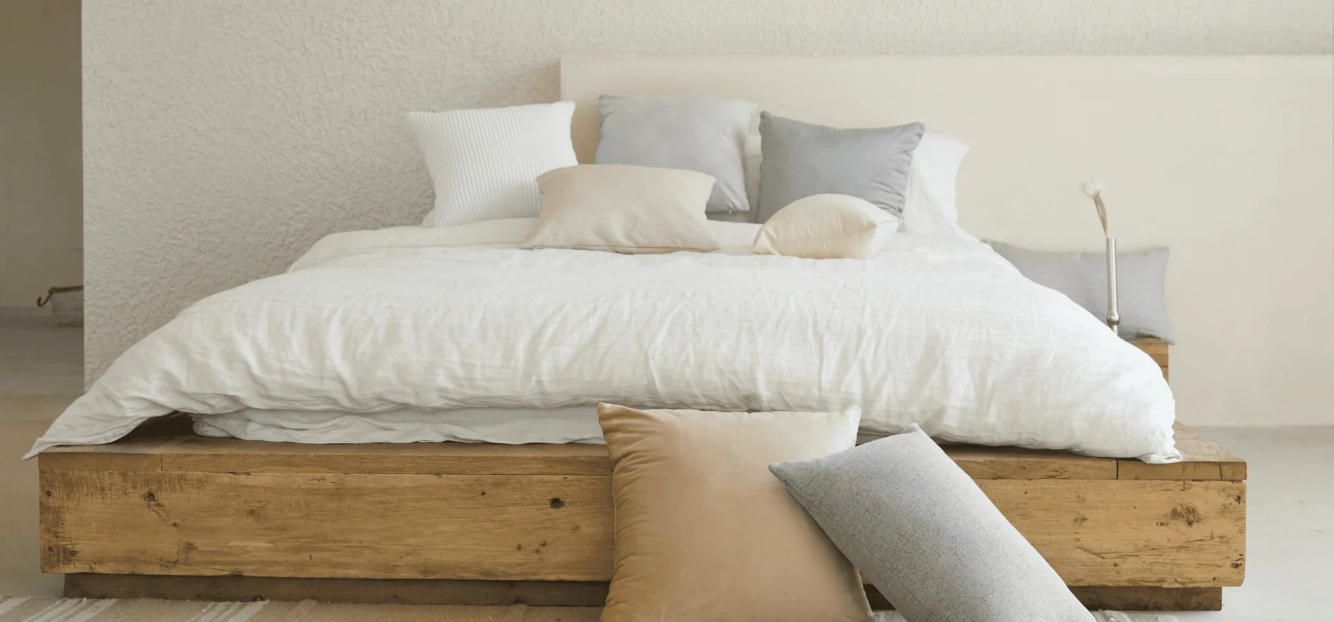 Image of a large bed with pillows on top