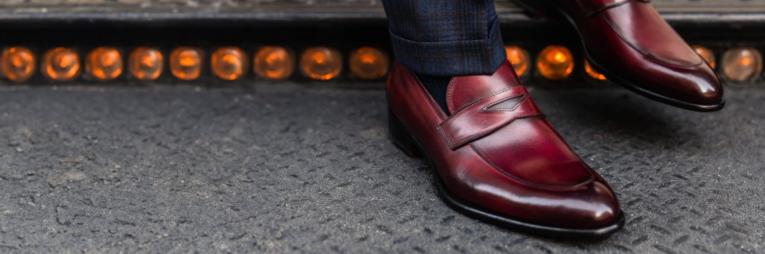 A pair of mens maroon loafers