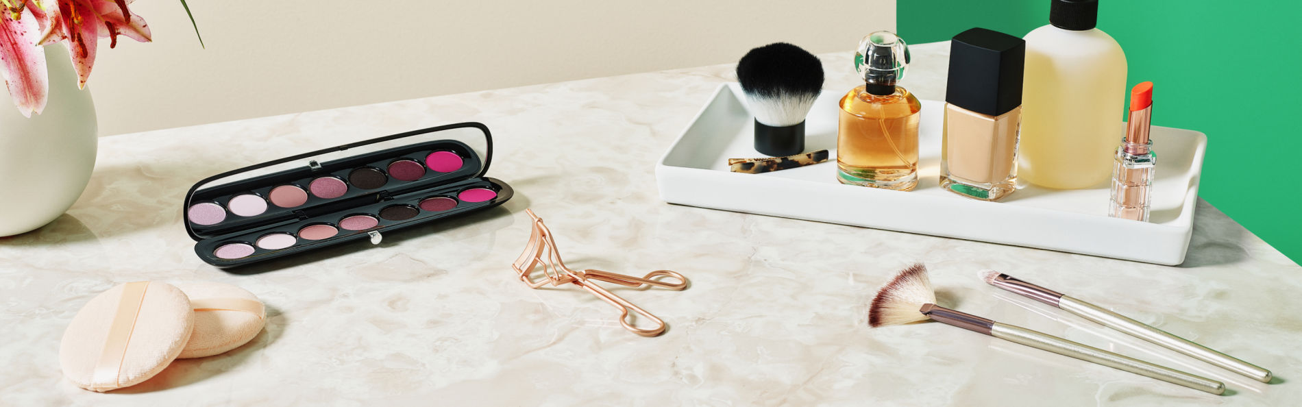 image of makeup case, perfume and brushes