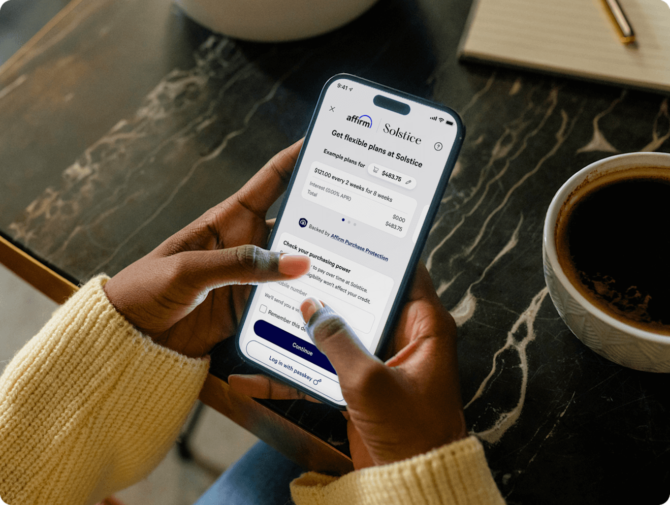 Person using a smartphone to make a purchase with Affirm