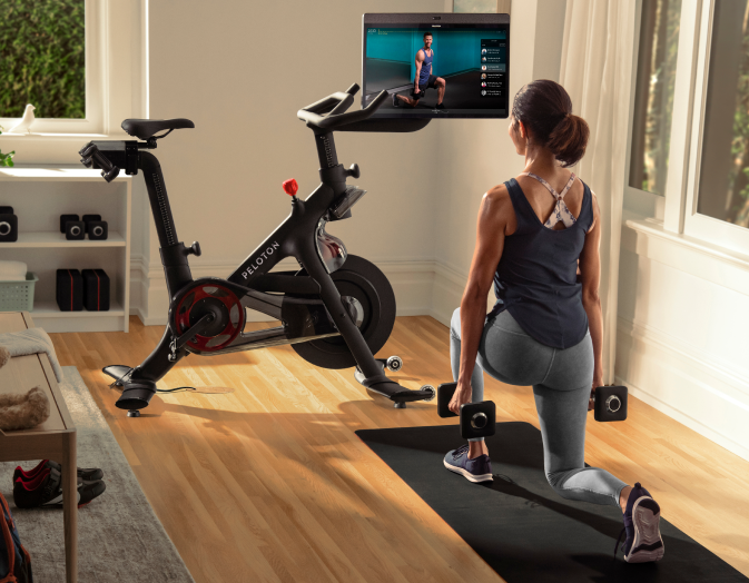 Woman working out with Peloton