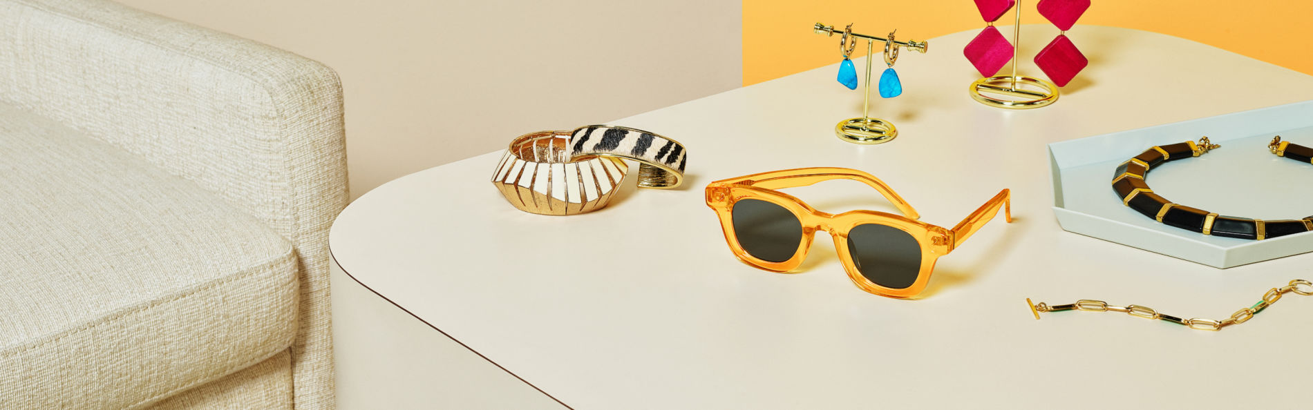 image of sunglasses and accessories on table