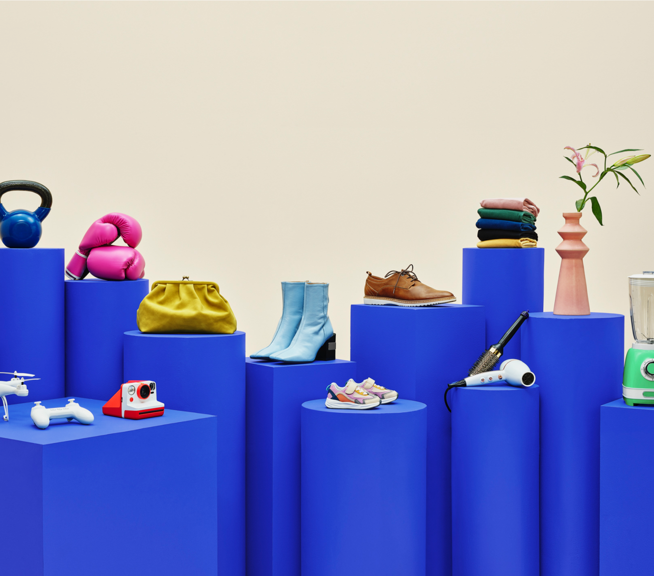 image of shoes and various objects on blue pedestals