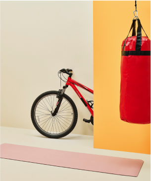 image of punching bag and bike in background