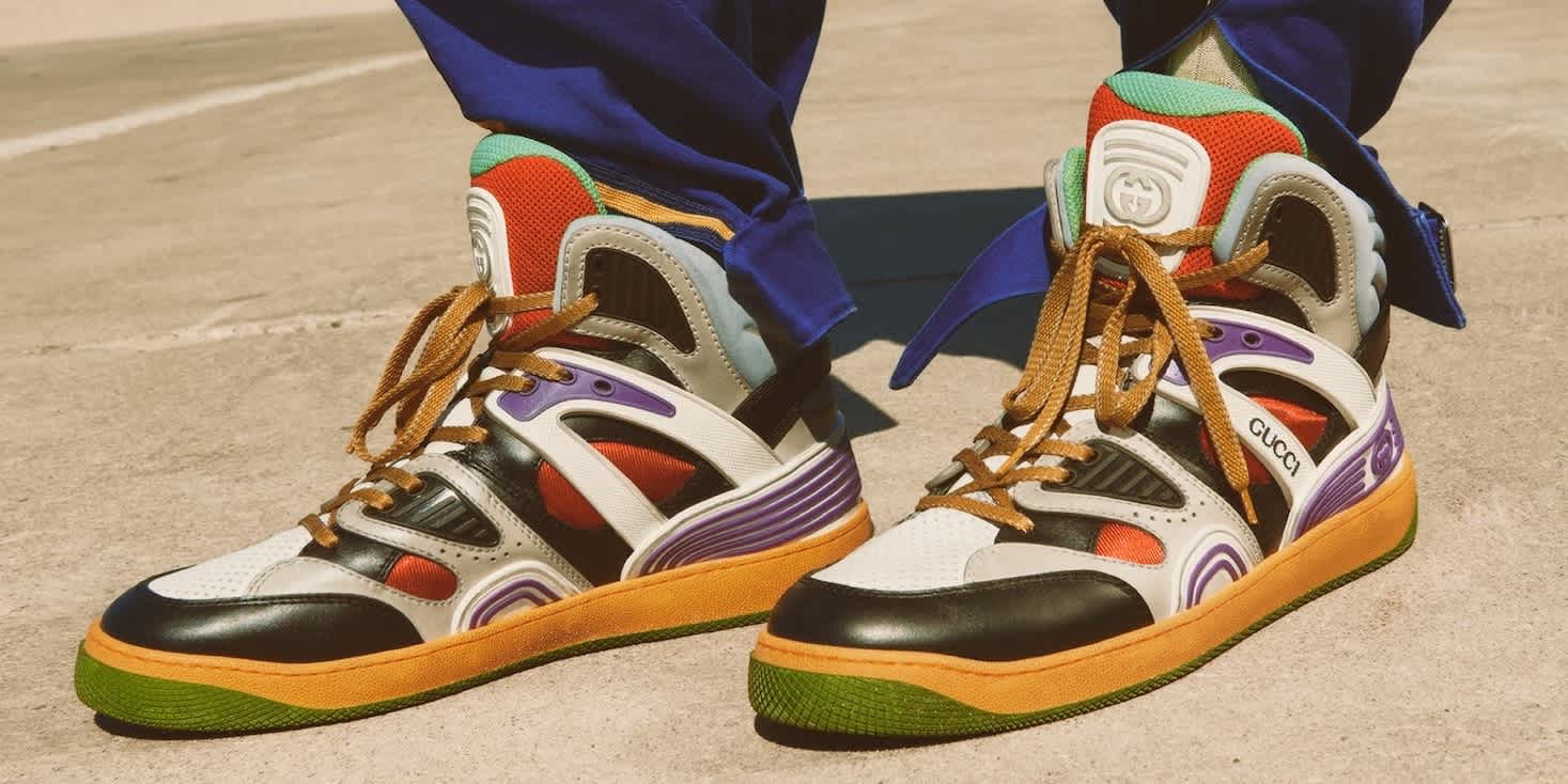 Closeup on pair of very colorful men's sneakers that are available to buy at LuisaViaRoma