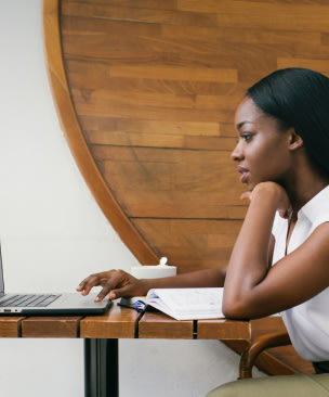 Woman looking at laptop