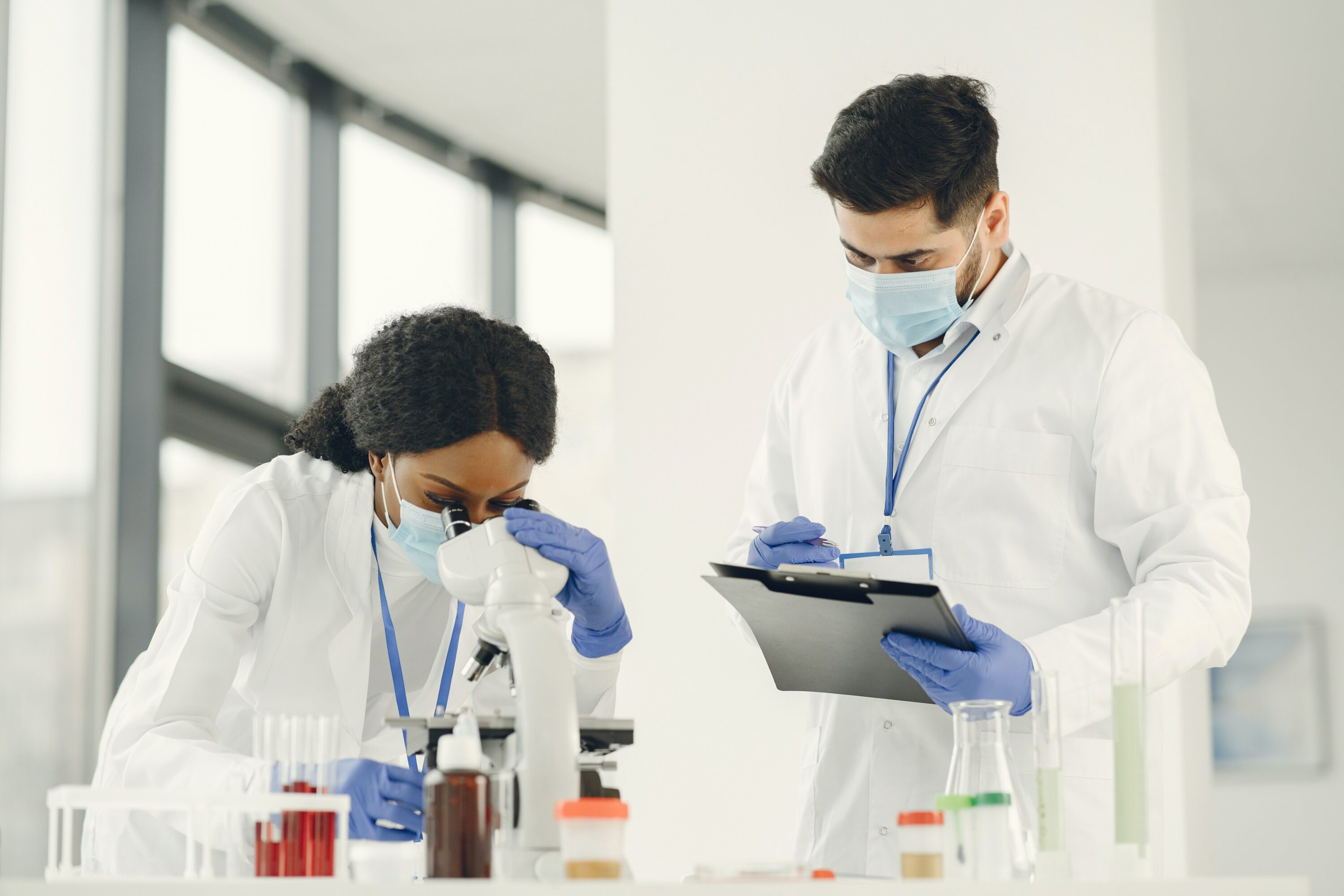 man and woman doing lab analyses