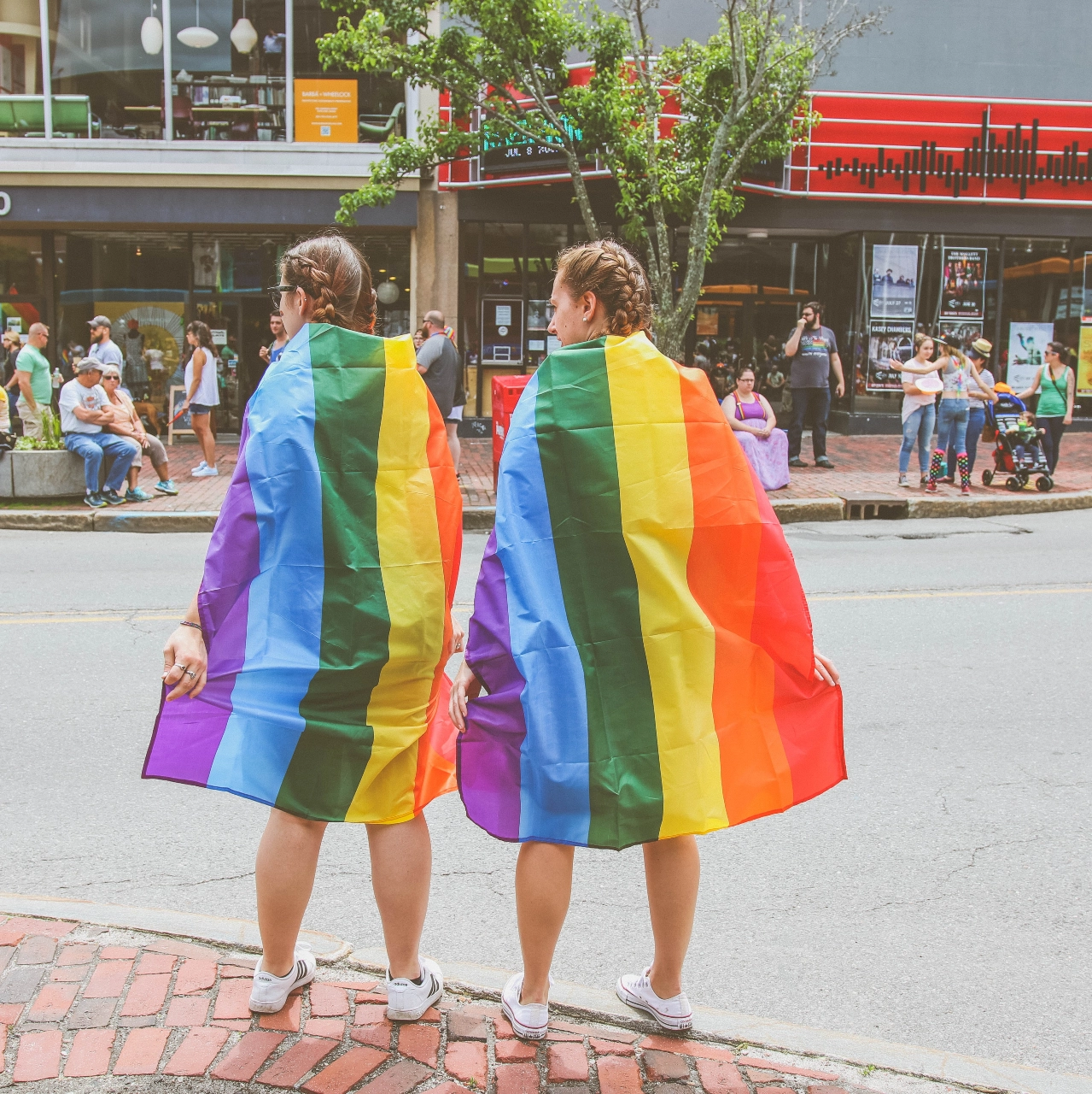 2 girls with rainbow cape