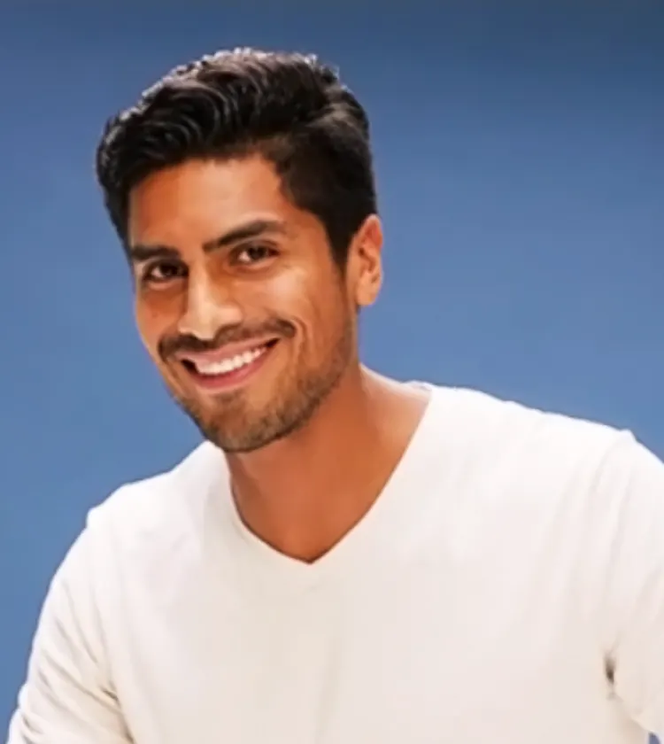 Person in a white shirt preparing with 3-Day Stubble Beard