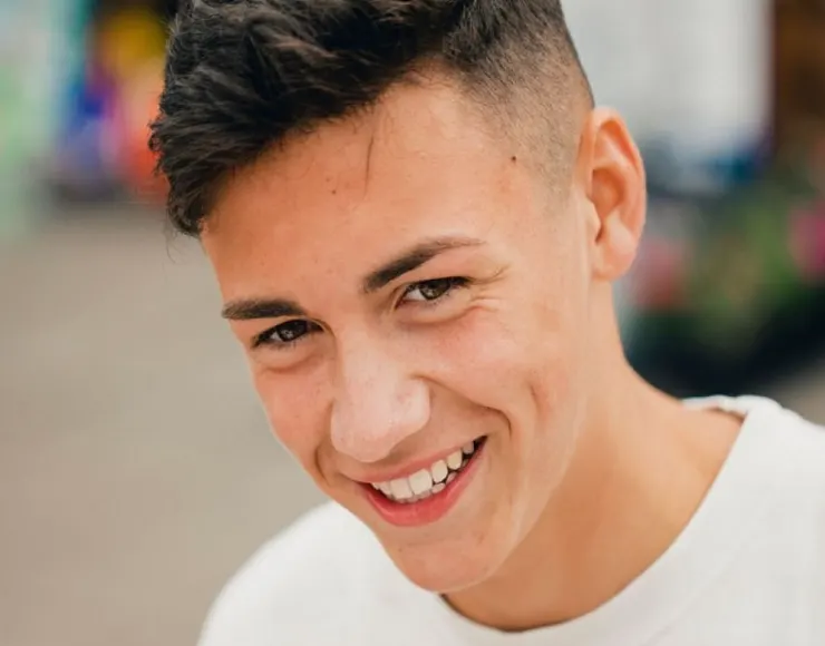 Smiling teenager, ready for first shave 