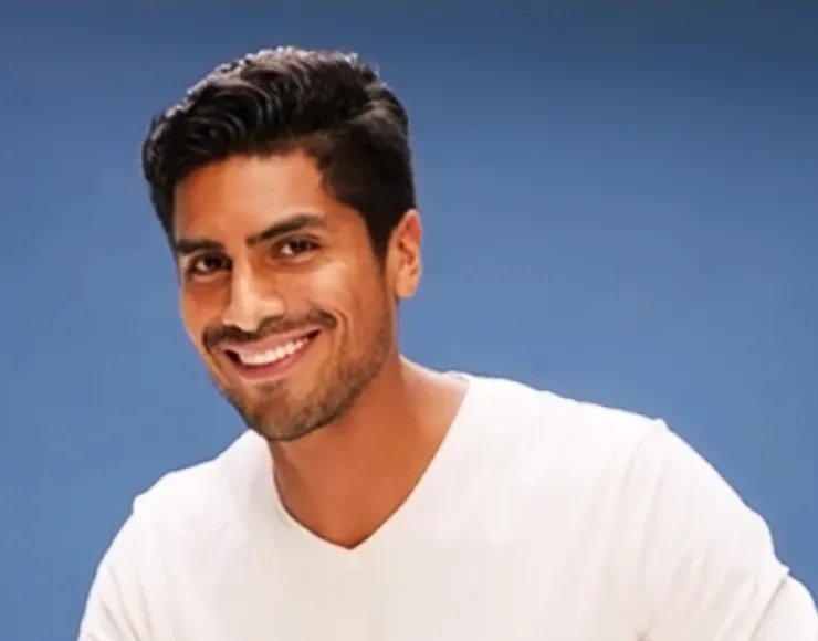 Person in a white shirt preparing with 3-Day Stubble Beard