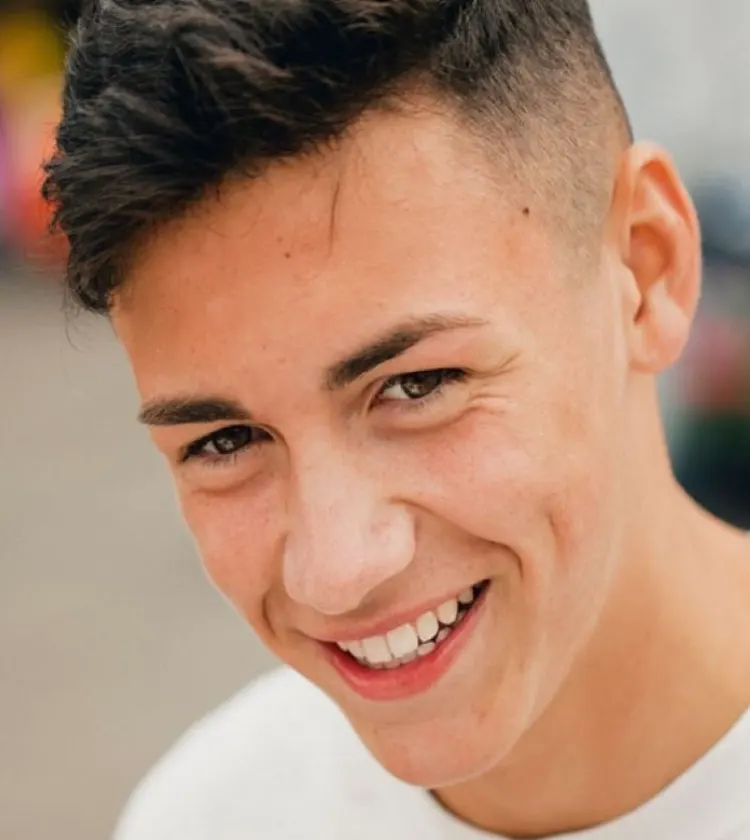 Smiling teenager, ready for first shave 
