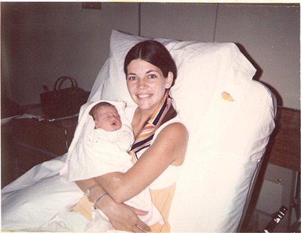 Elizabeth at age 22 holding her newborn daughter, Amelia